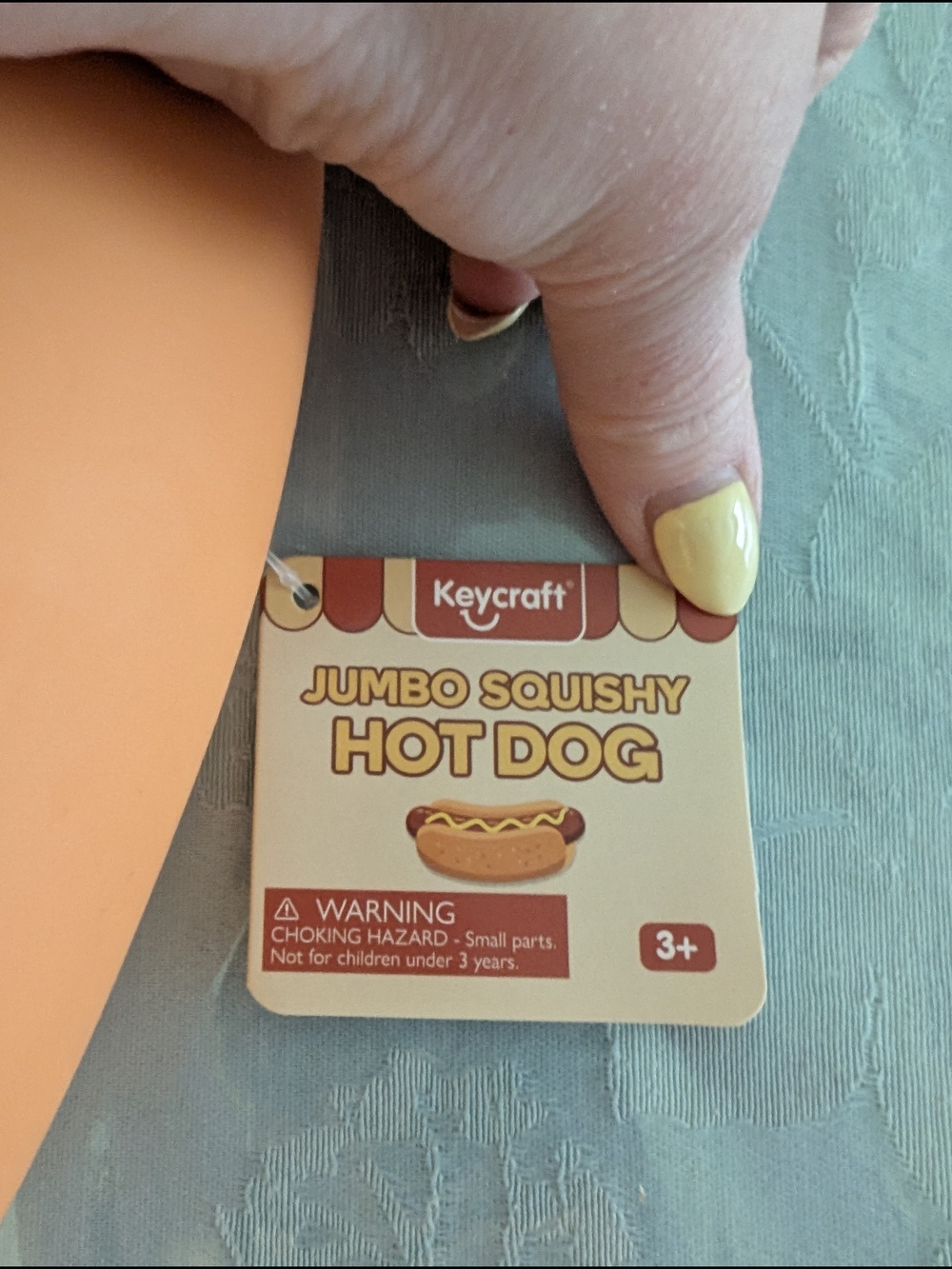 Craft Jumbo Squishy Hot Dog Toy in Orange and Brown with Yellow Accent - Picture 2 of 2